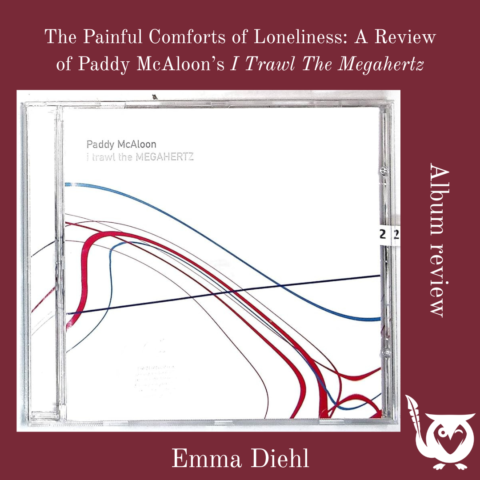 A CD case displaying the album I Trawl the Megahertz by Paddy McAloon sits centered against a deep maroon background. The cover features minimalist curved lines in red, blue, and black across a white field. Text above reads “The Painful Comforts of Loneliness: A Review of Paddy McAloon’s I Trawl the Megahertz,” with “Album Review” along the side and the MockingOwl Roost owl logo in the bottom right corner. I Trawl the Megahertz TEXT: The Painful Comforts of Loneliness: A Review of Paddy McAloon’s I Trawl the Megahertz, Emma Diehl