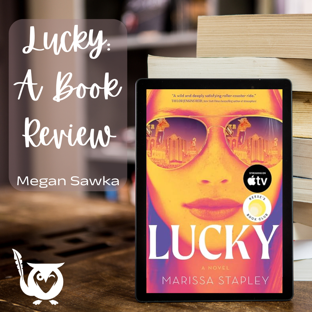 Lucky_A_Book_Review An ipad sitting up on a table with the book cover of Lucky on the front. lucky Text: Lucky, a book review, Megan Sawka
